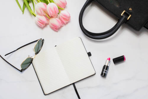 Stock photo black and white desk and notebook