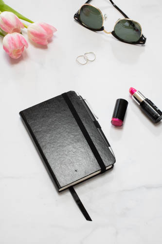 Stock photo black and white desk and notebook