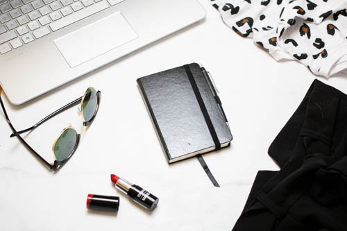 Stock photo black and white desk and notebook