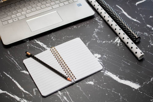 Stock photo black and white desk and notebook