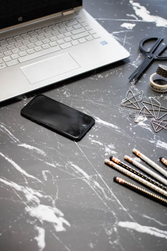 Stock photo black and white desk and notebook