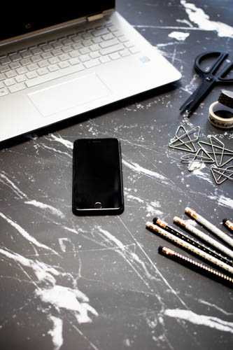 Stock photo black and white desk and notebook