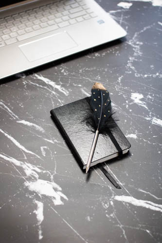 Stock photo black and white desk and notebook